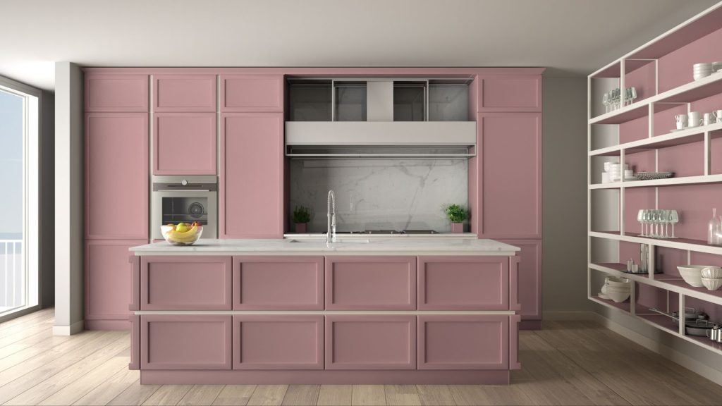 A modern pink kitchen with a sink and shelves, showcasing stylish kitchen cabinets