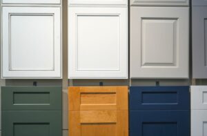 A display of kitchen cabinets in multiple colors, highlighting diverse design options for modern kitchens.