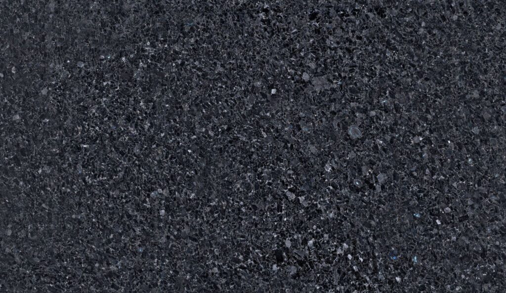 Seamless dark gray polished granite stone texture with subtle mineral flecks.