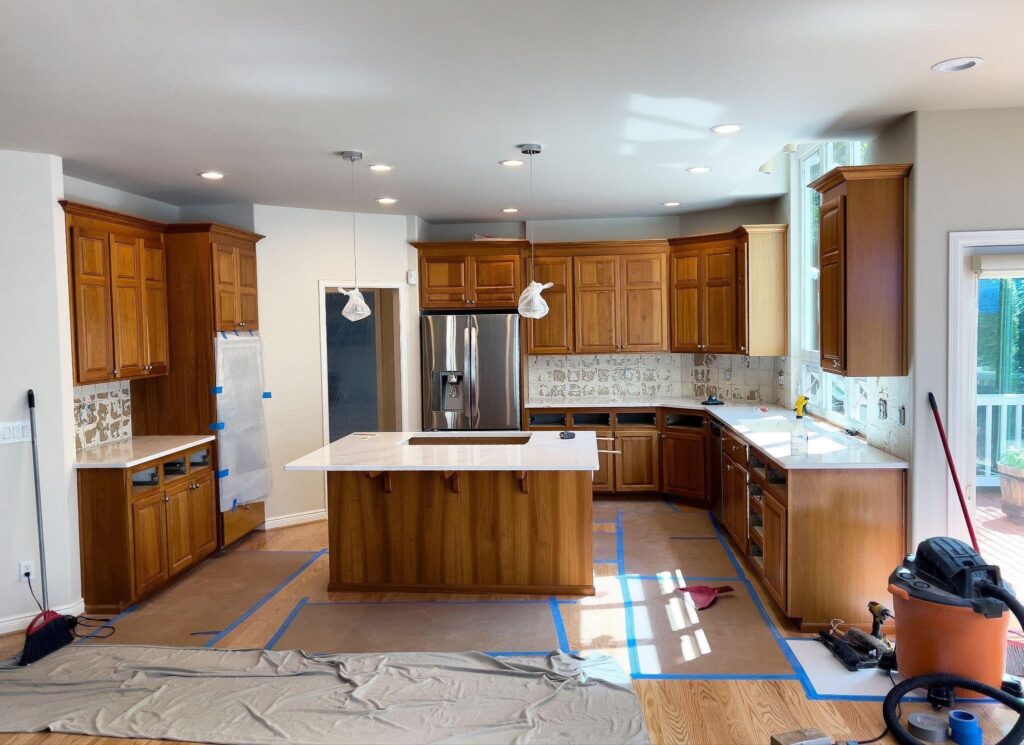A spacious kitchen with a large island and elegant wooden cabinets showcasing a modern desig